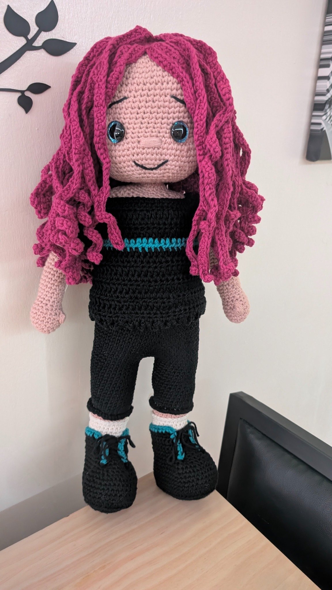 Pink-haired crochet doll, handmade by SnuggleStitch Creations